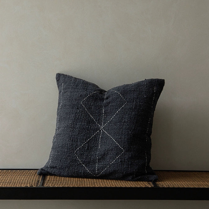 Boho throw pillow with diamond stitch detail, beige, black, natural. Woven cushion for living room.